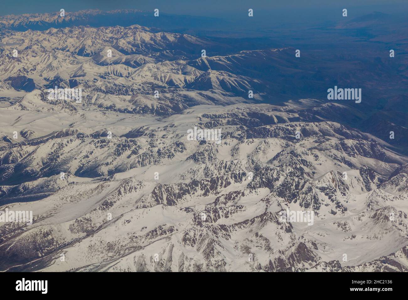 Aerial view of snow covered Tian Shan mountains in Kyrgyzstan Stock ...