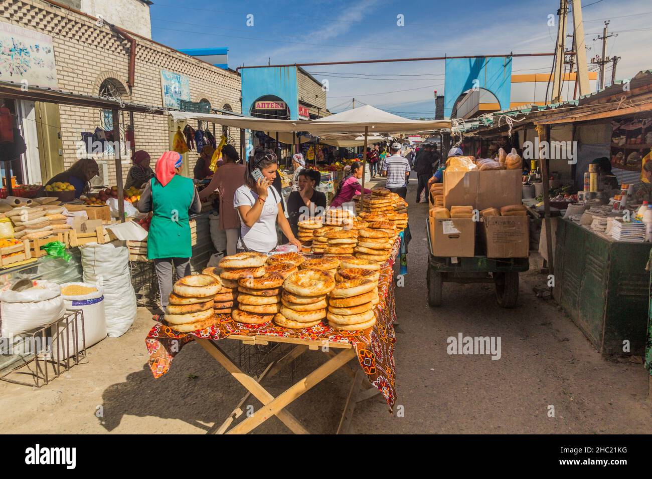 TURKISTAN, KAZAKHSTAN - MAY 31, 2018: Bread and fruit sellers at the bazaar in Turkistan, Kazakhstan Stock Photo