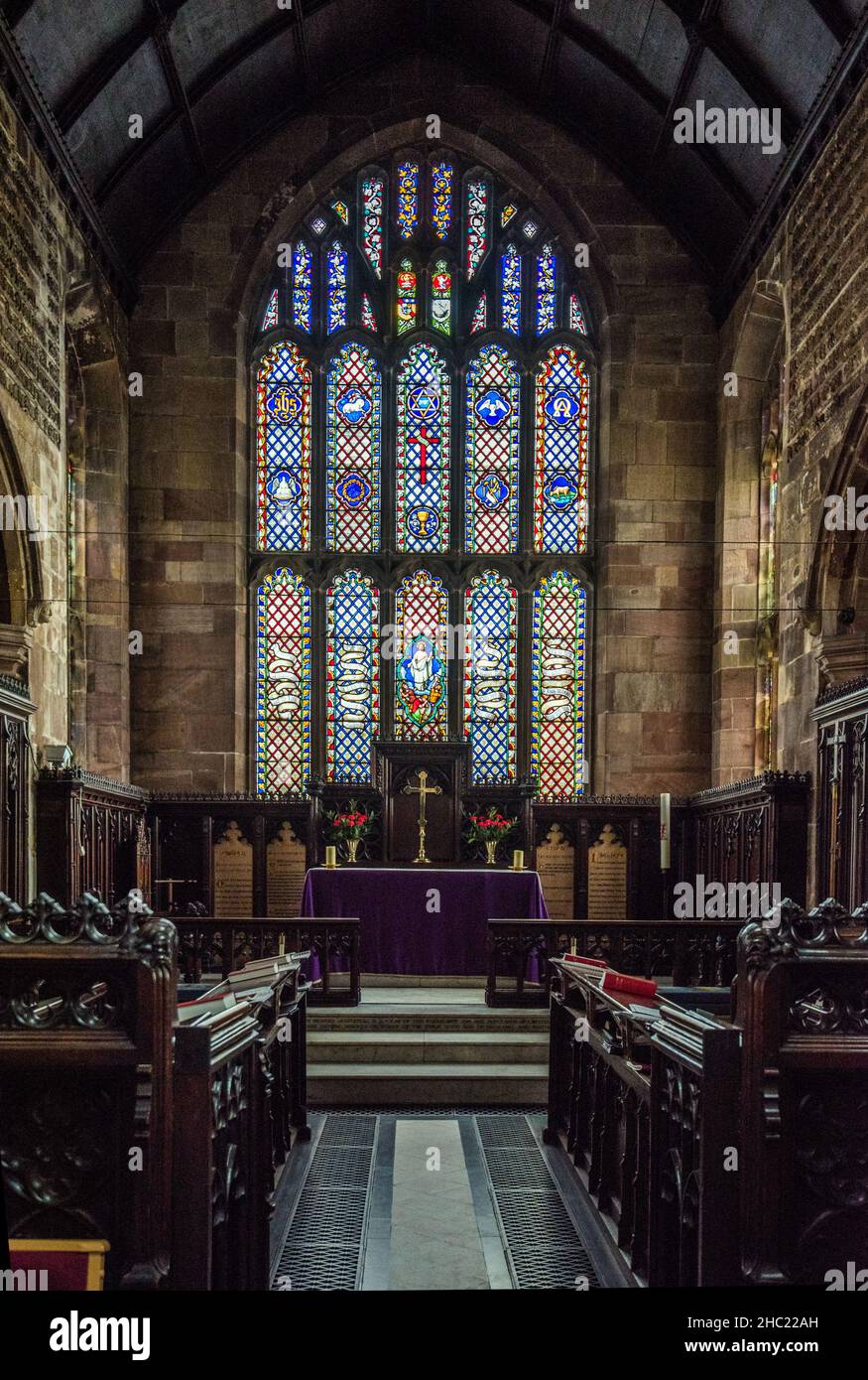 The beautiful stained glass above the altar at St Marys church, Sandbach,Cheshire Stock Photo