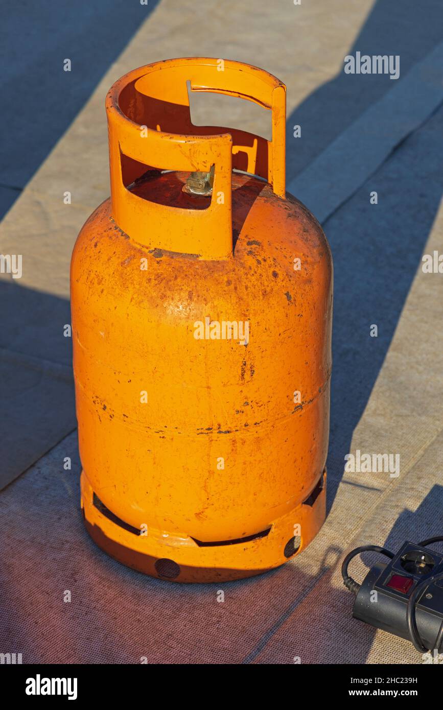 One Used Orange Propane Gas Bottle Old Type Stock Photo Alamy