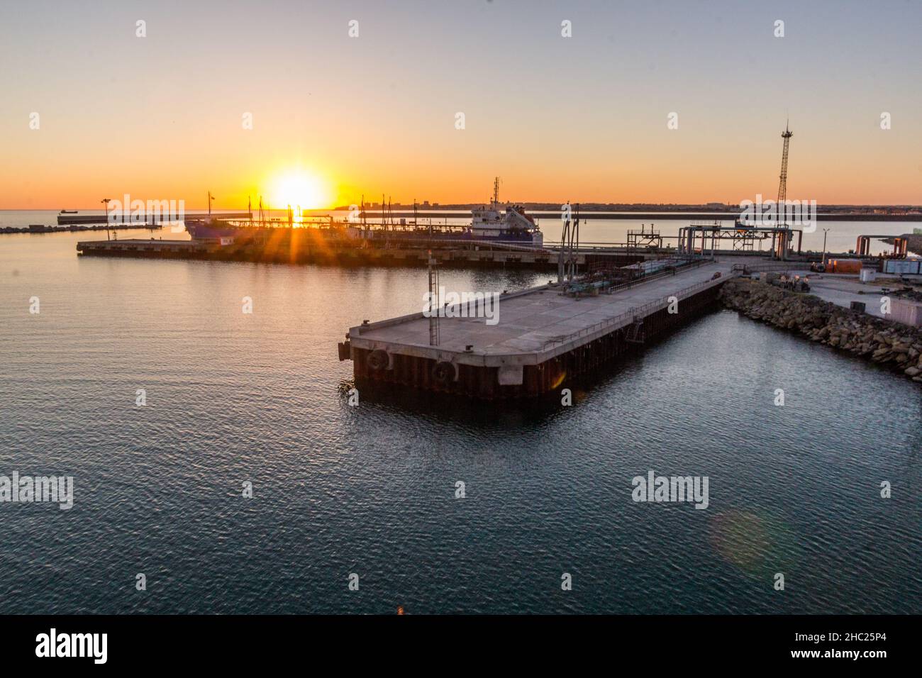 Sunset in Aktau Port, Kazakhstan Stock Photo - Alamy
