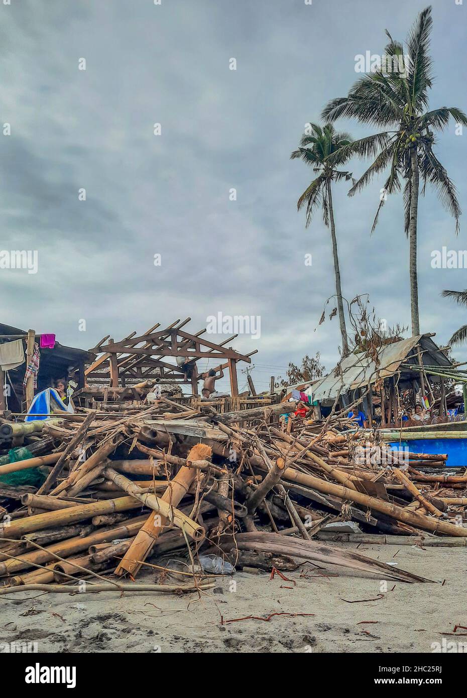 (211222) -- LEYTE PROVINCE, Dec. 22, 2021 (Xinhua) -- Photo shows a fishing community damaged by Typhoon Rai along a shoreline in Leyte Province, the Philippines, Dec. 22, 2021.  The National Disaster Risk Reduction and Management Council (NDRRMC) reported that 156 people died from the typhoon, while the Philippine National Police reported at least 375 deaths. Many more are missing or injured.   On Thursday afternoon, Typhoon Rai first swept across Siargao Island, off the eastern coast on Mindanao island in the southern Philippines. It lashed the Southeast Asian country for three days, causing Stock Photo