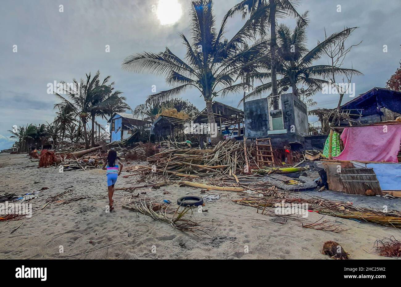 (211222) -- LEYTE PROVINCE, Dec. 22, 2021 (Xinhua) -- Photo shows a fishing community damaged by Typhoon Rai along a shoreline in Leyte Province, the Philippines, Dec. 22, 2021.  The National Disaster Risk Reduction and Management Council (NDRRMC) reported that 156 people died from the typhoon, while the Philippine National Police reported at least 375 deaths. Many more are missing or injured.   On Thursday afternoon, Typhoon Rai first swept across Siargao Island, off the eastern coast on Mindanao island in the southern Philippines. It lashed the Southeast Asian country for three days, causing Stock Photo
