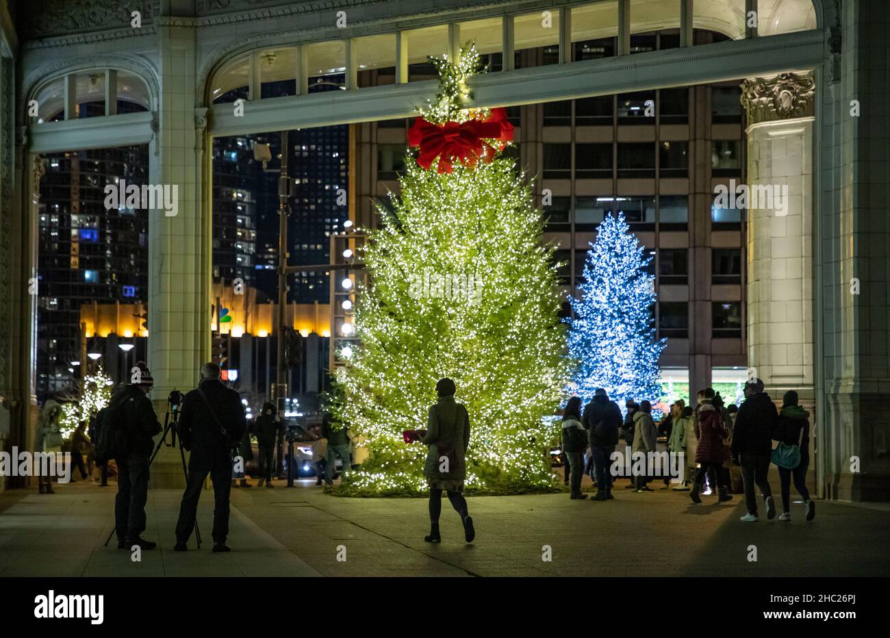 Chicago, USA. 19th Dec, 2021. Two Christmas trees are seen on Michigan Ave. during the holiday season in Chicago, the United States, Dec. 19, 2021. Credit: Joel Lerner/Xinhua/Alamy Live News Stock Photo