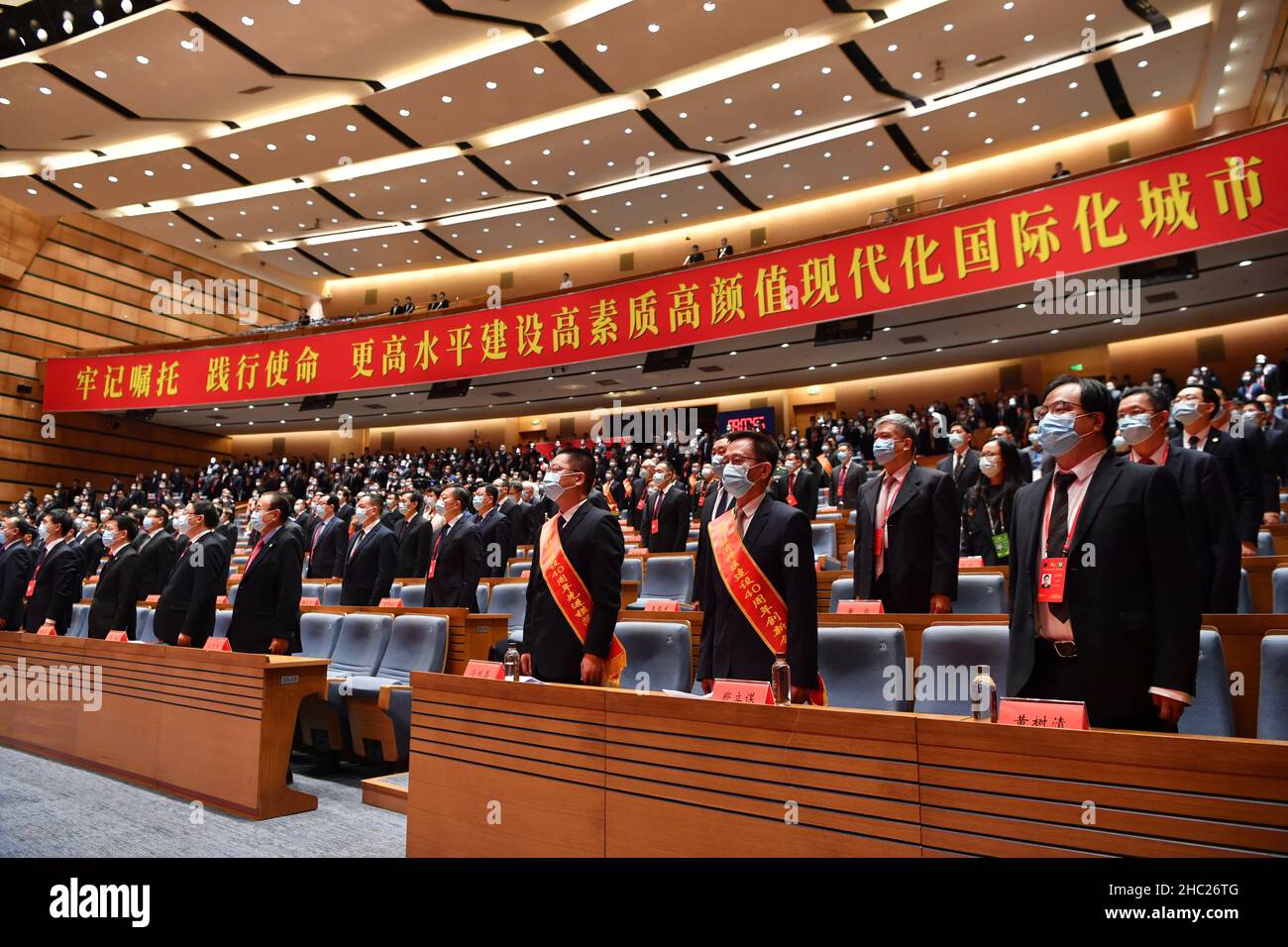 Xiamen, China's Fujian Province. 21st Dec, 2021. Representatives sing the national anthem at a gathering marking the 40th anniversary of the establishment of the Xiamen Special Economic Zone in Xiamen, southeast China's Fujian Province, Dec. 21, 2021. Credit: Jiang Kehong/Xinhua/Alamy Live News Stock Photo