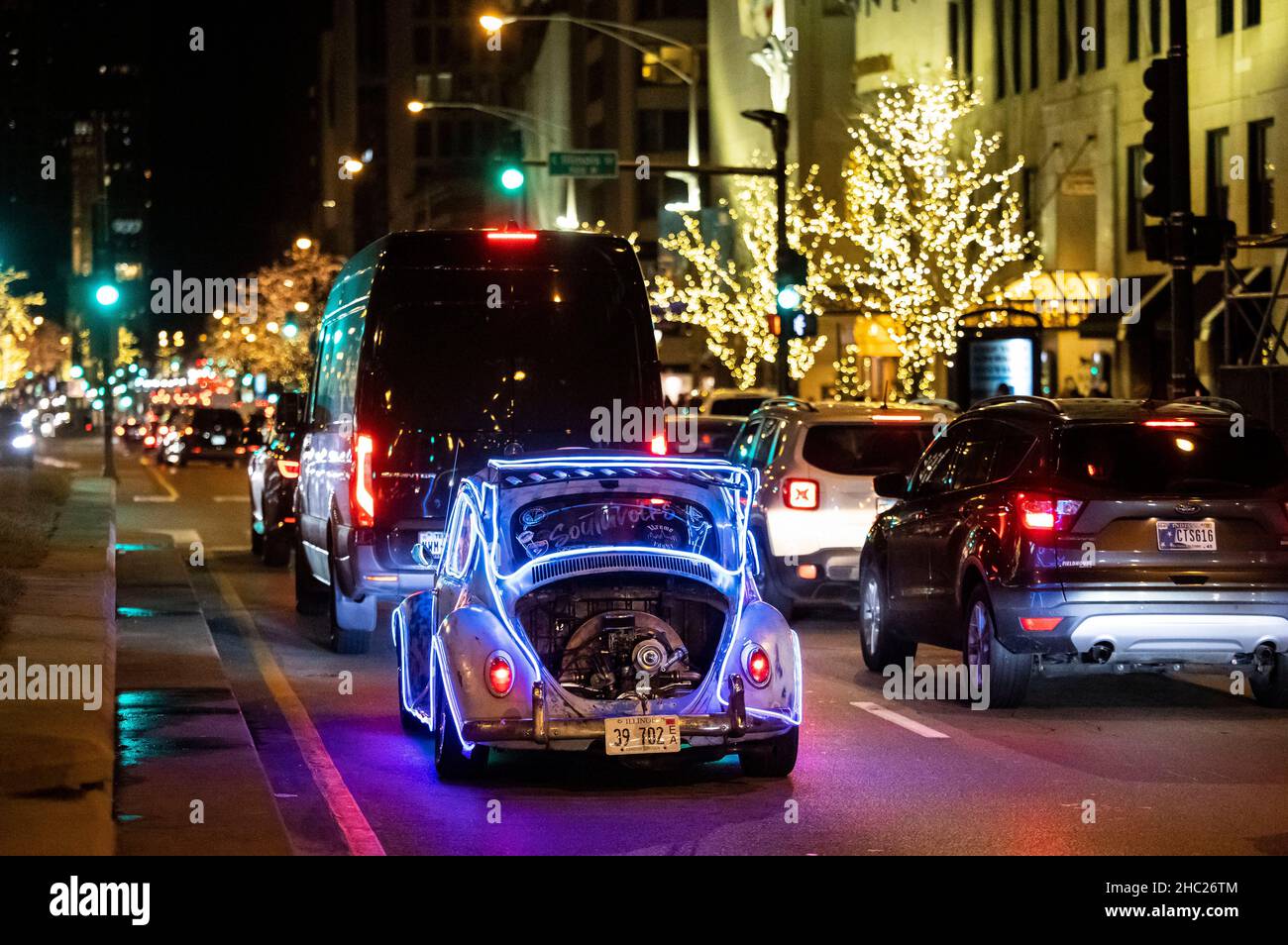 Chicago, USA. 19th Dec, 2021. A VW Beetle is seen on Michigan Ave. during the holiday season in Chicago, the United States, Dec. 19, 2021. Credit: Joel Lerner/Xinhua/Alamy Live News Stock Photo