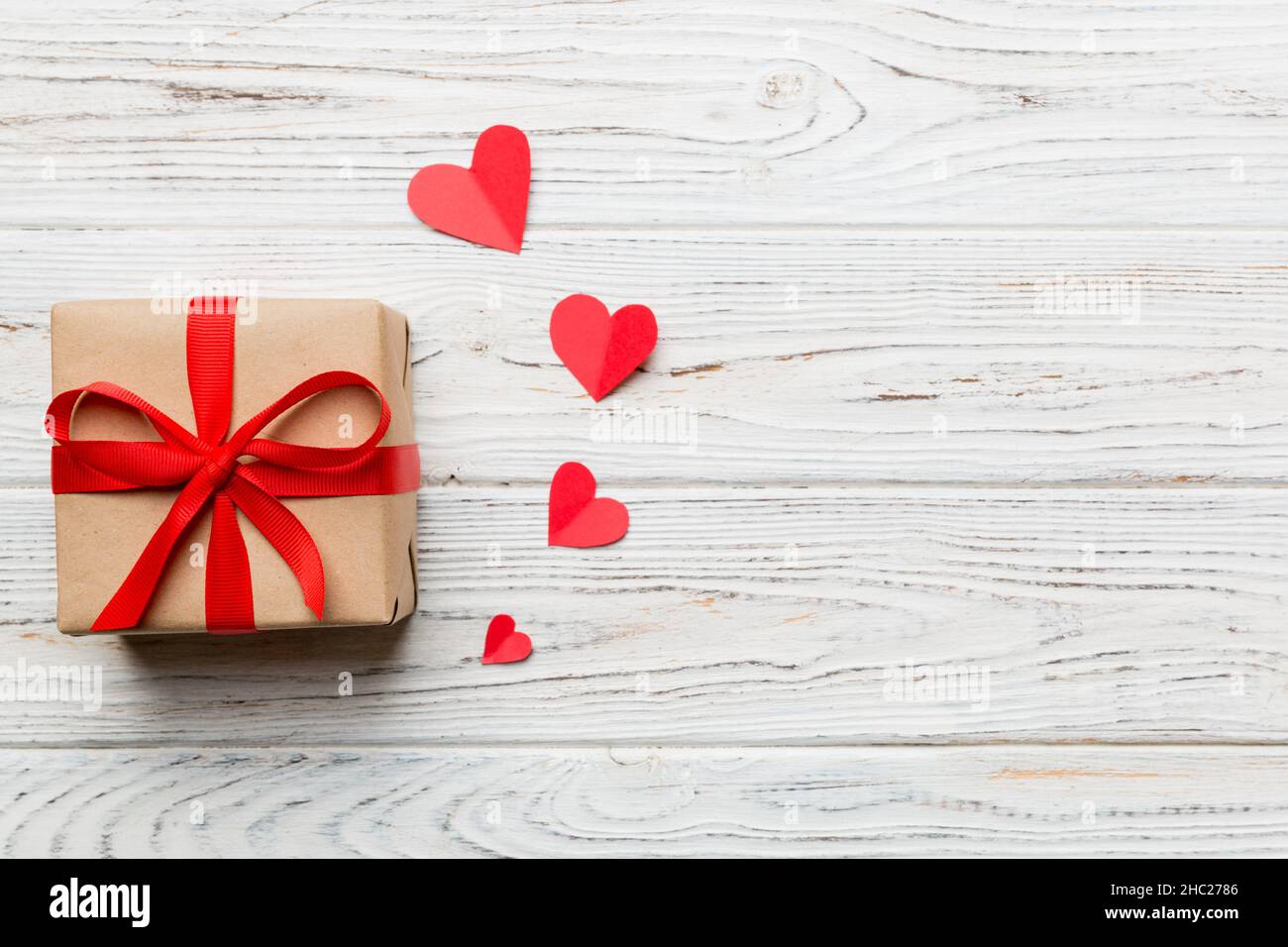Valentine day composition: red gift box with bow and heart. Christmas ...