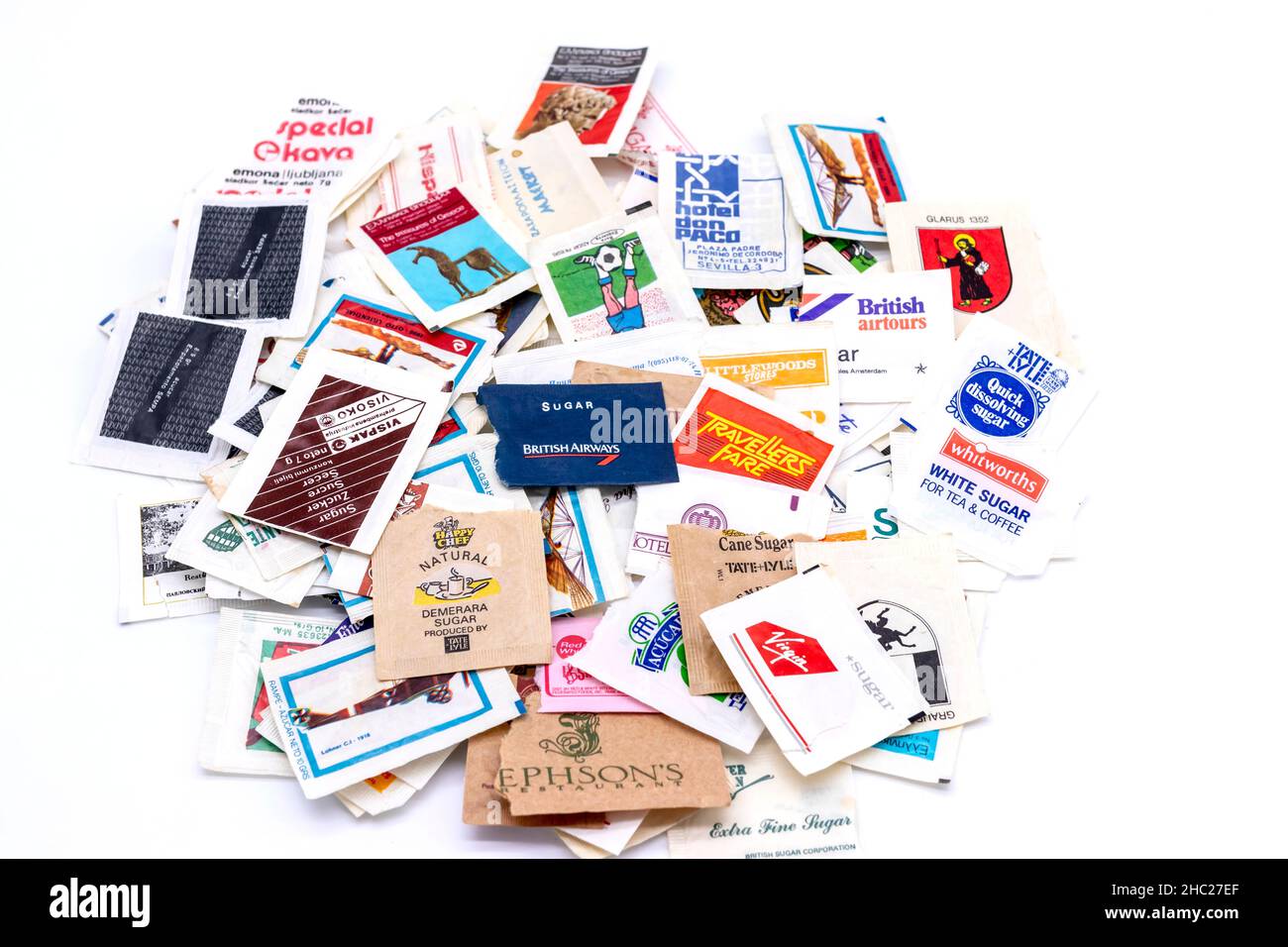 collection of vintage branded hotel and airline sugar sachets or