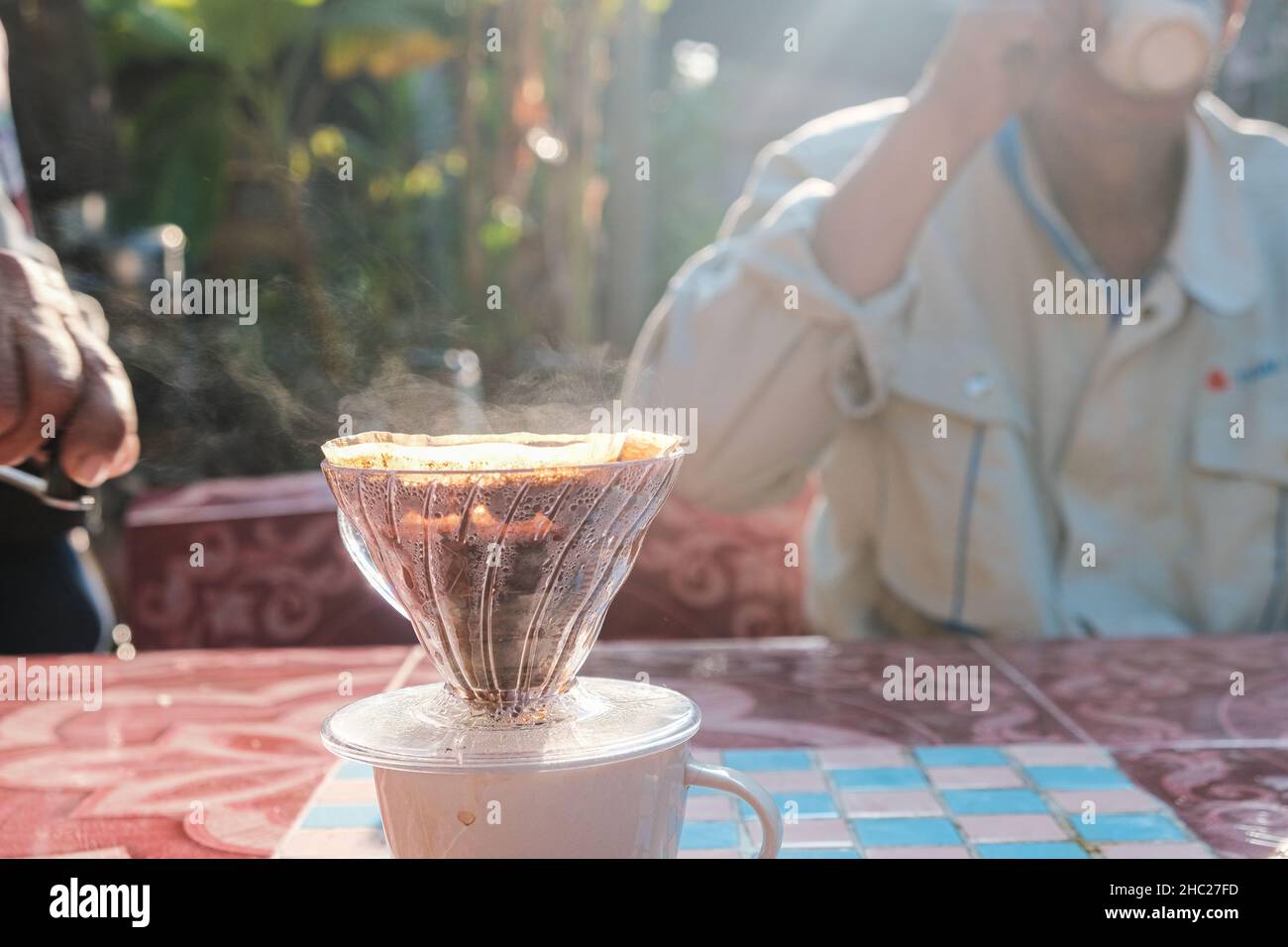 Coffee drip and smoke with group of people friend hand grind coffee in
