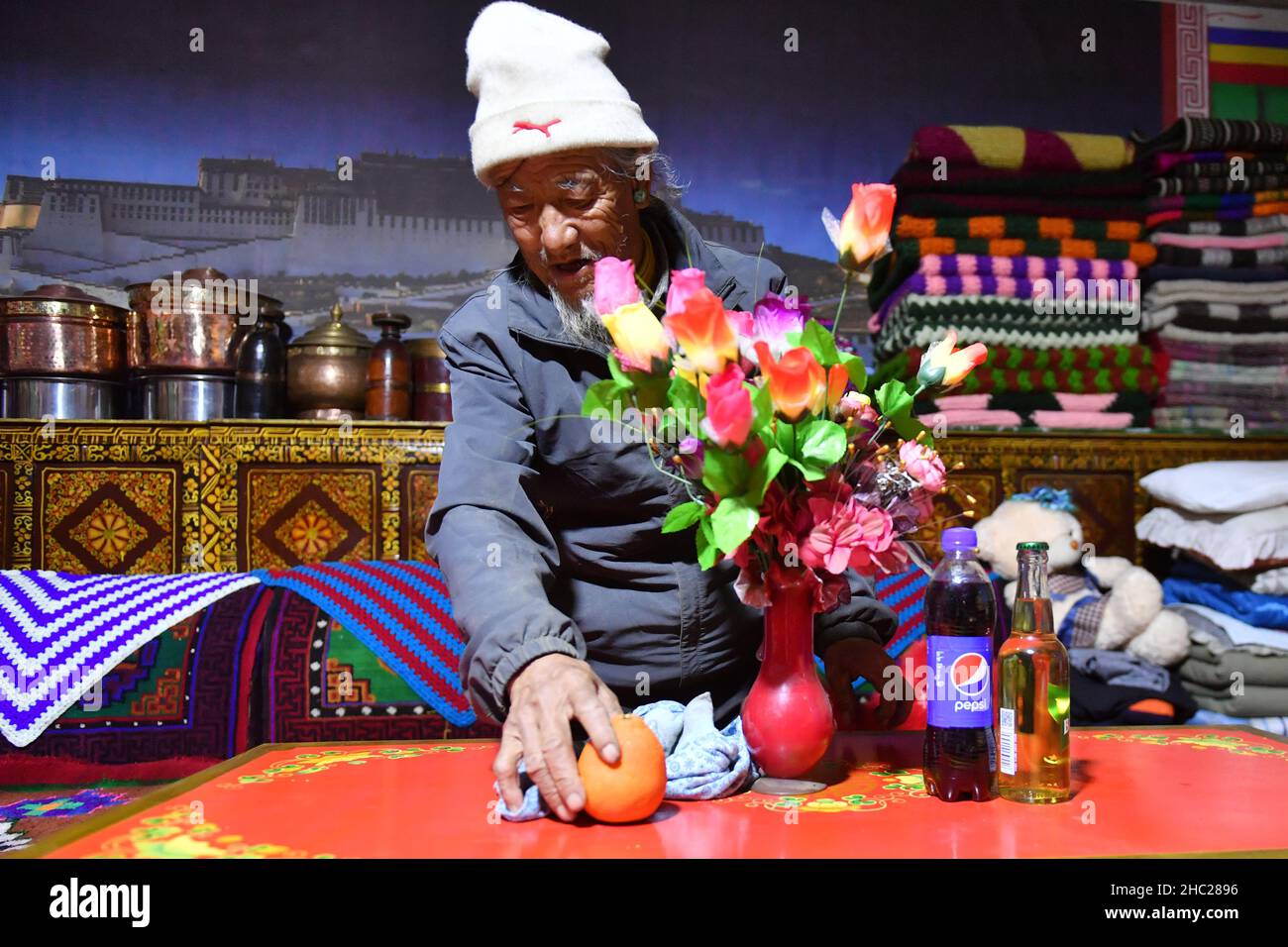 (211219) -- LHASA, Dec. 19, 2021 (Xinhua) -- Tsering Dondrup is pictured at home in Jianggang Village of Nyalam County, Xigaze City of southwest China's Tibet Autonomous Region, May 13, 2021. Born in 1947, Tsering Dondrup lives in Jianggang Village, Nyalam County of Tibet.    Tsering and his family members served as enslaved farmers for their serf owner in old Tibet. Drudgeries including farming, collecting firewood and cow dung fell on them with little rations could be earned from serf owner. When it came to harvest, the ripe highland barley they had planted were claimed by serf owner. 'If we Stock Photo