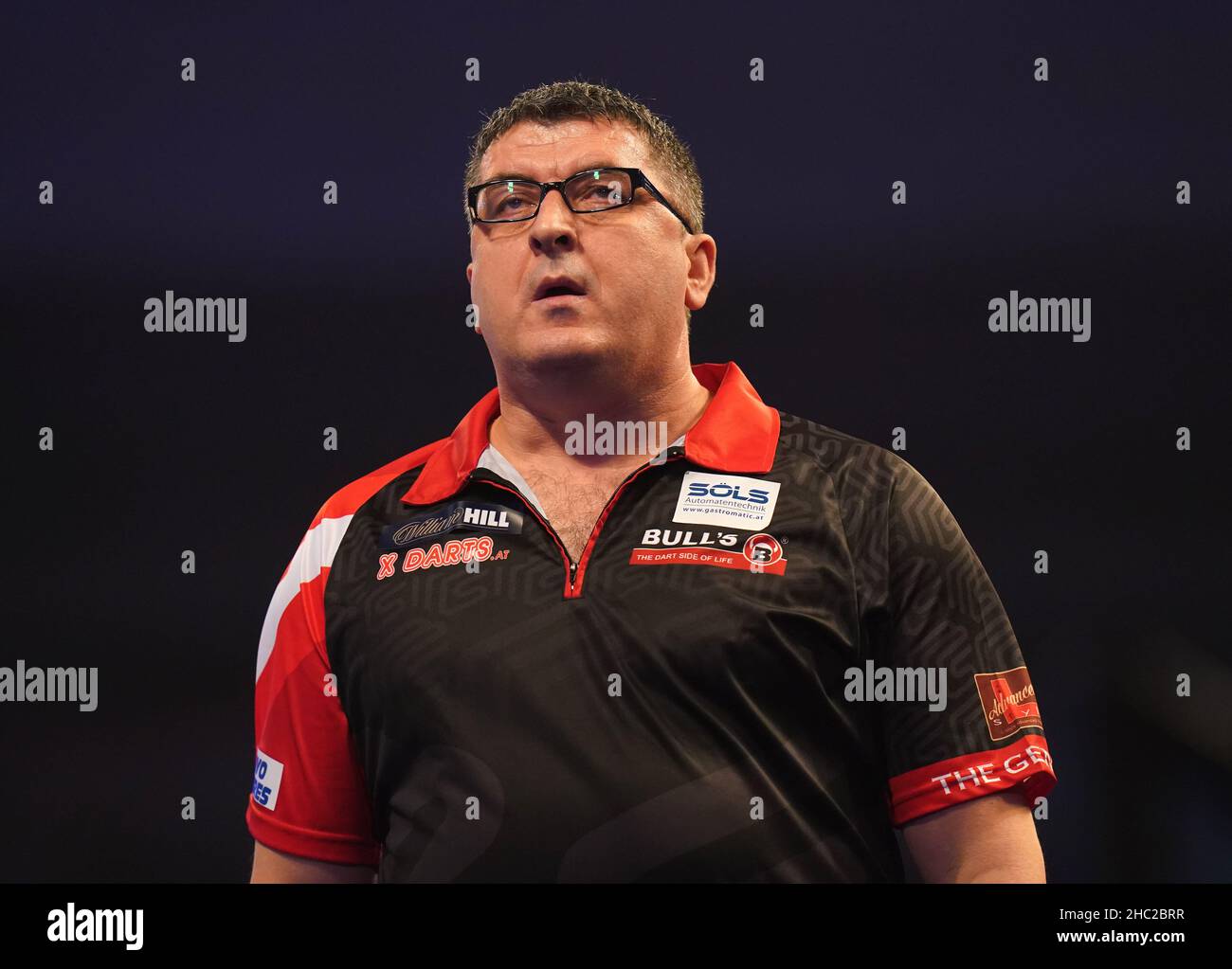Mensur Suljovic in action during day nine of the William Hill World Darts  Championship at Alexandra Palace, London. Picture date: Thursday December  23, 2021 Stock Photo - Alamy