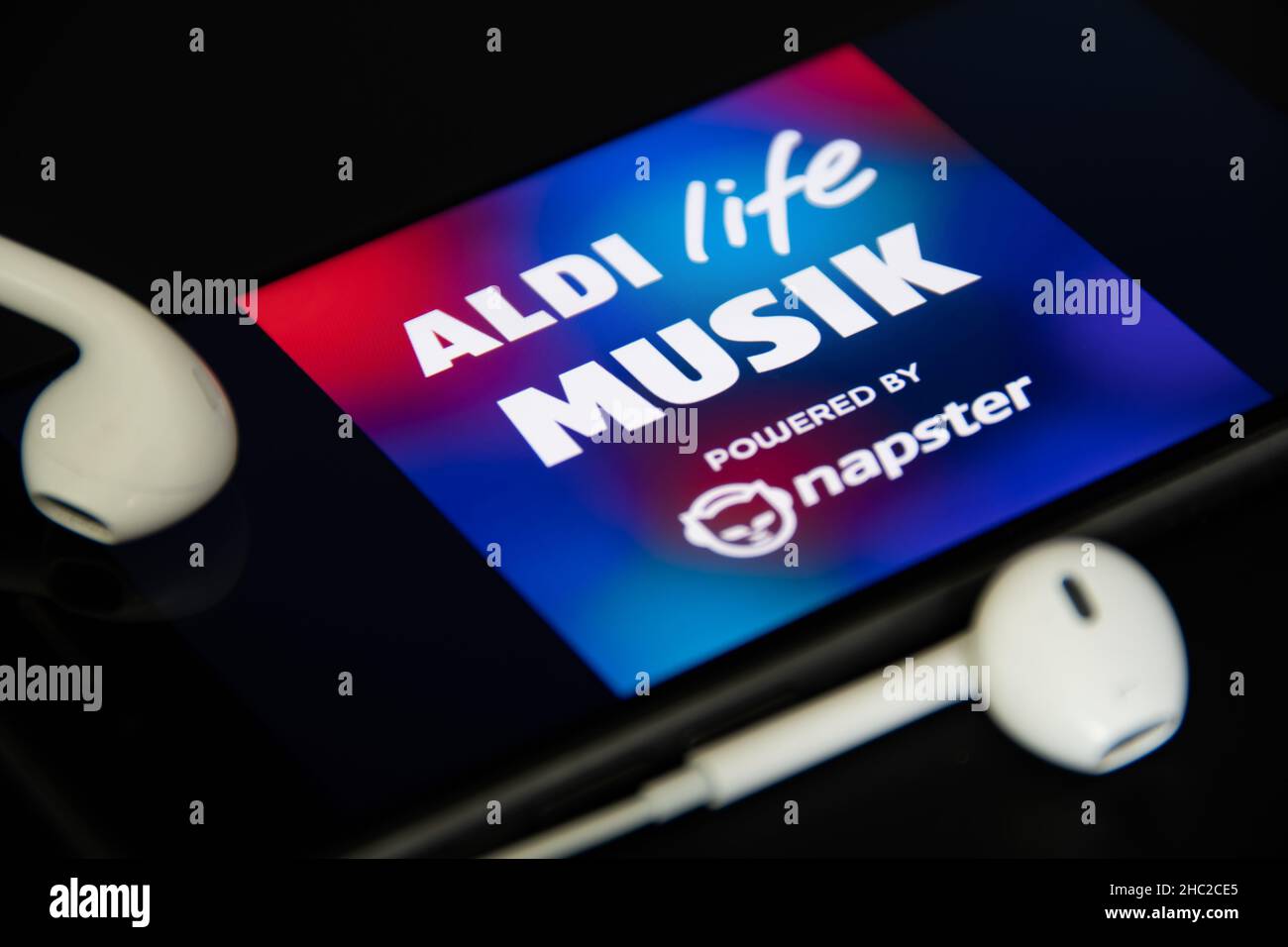 Rheinbach, Germany  4 May 2021,  Close-up of the 'Aldi life Musik' logo on the screen of a smartphone with headphones Stock Photo