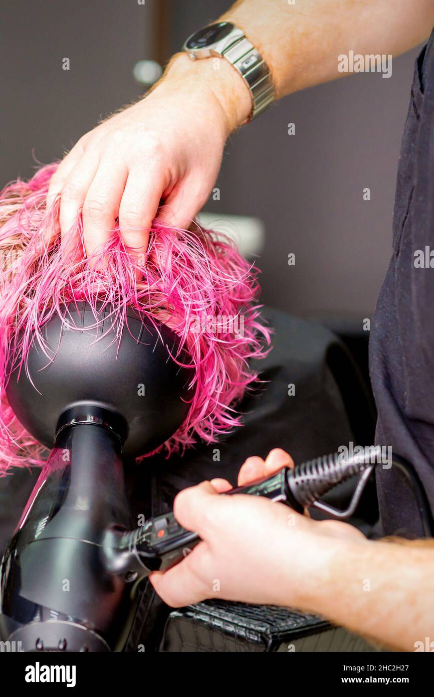 Making hairstyle using hair dryer hi-res stock photography and images ...