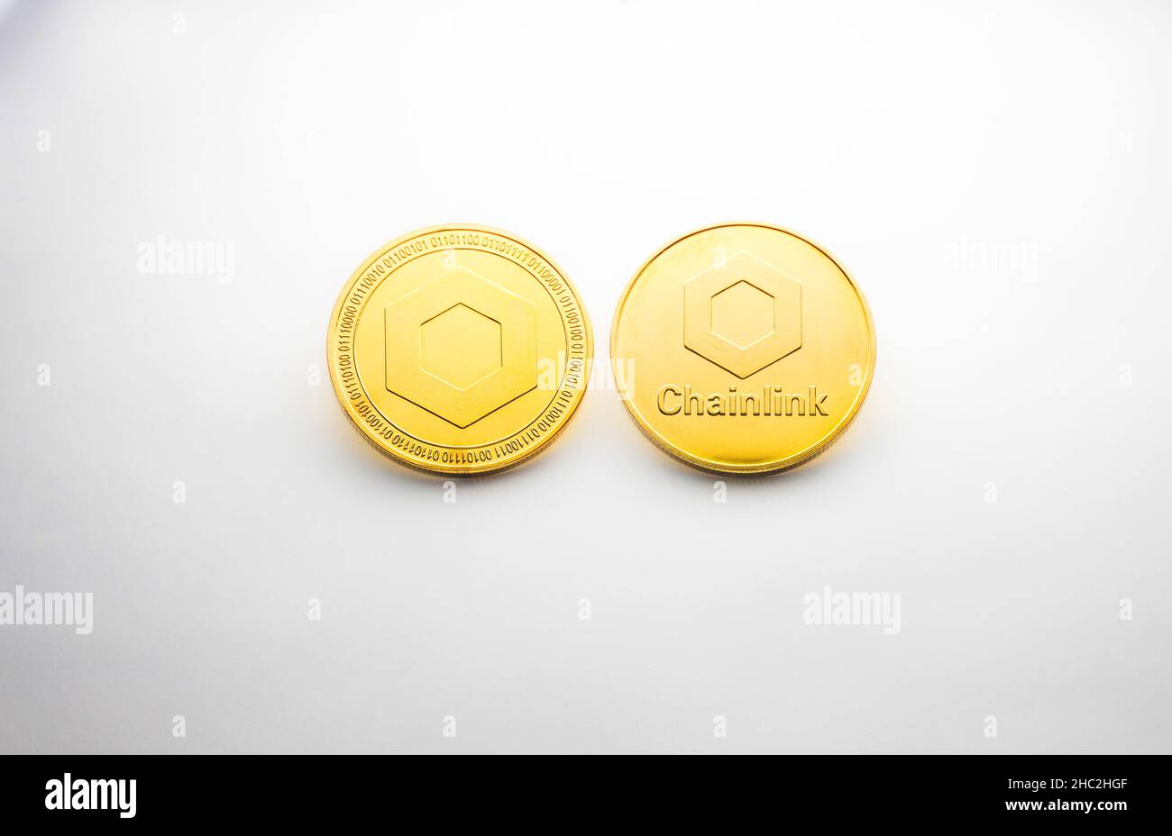 A crypto Chainlink golden coin photographed on a white background, as a product shooting Stock Photo