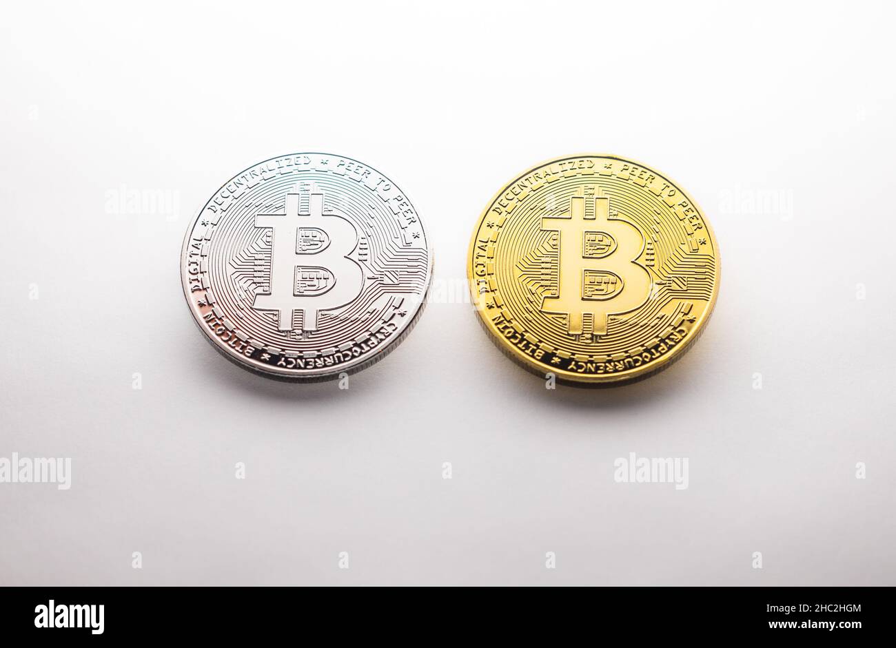 Two crypto Bitcoin gold and silver coins photographed on a white  background, as a product shooting Stock Photo - Alamy