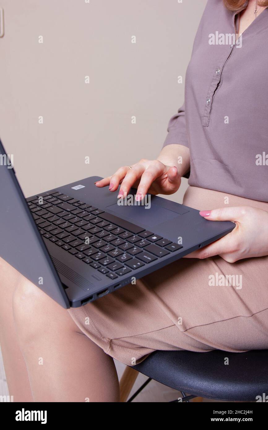Businesswoman typing on laptop at workplace Woman working in home office hand keyboard Stock Photo