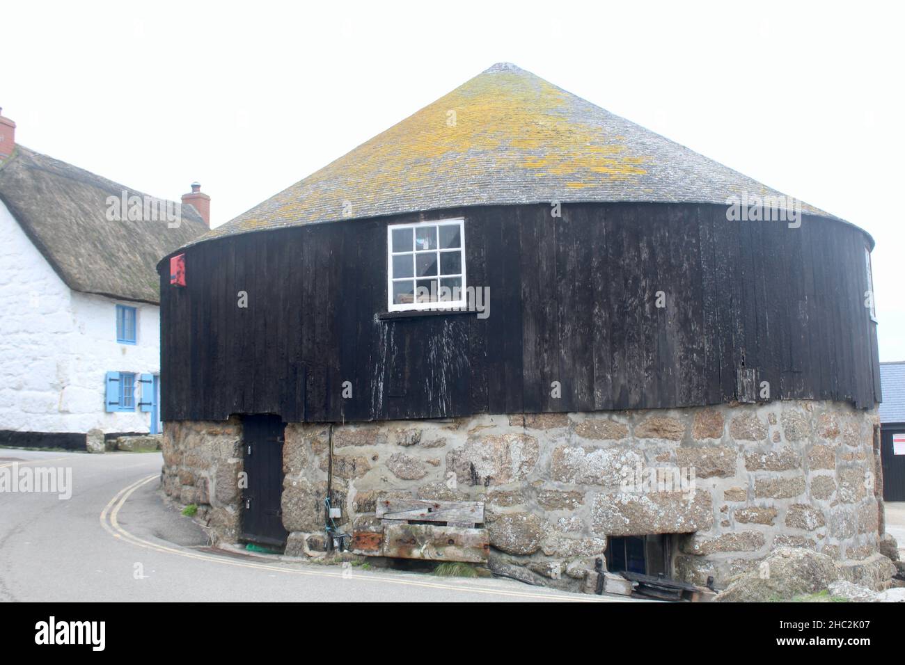 The Old Capstan or Roundhouse in Sennen Cove, Cornwall. Close to Lands End and on the South West Coastal Path. Now an art gallery and gift shop. Stock Photo