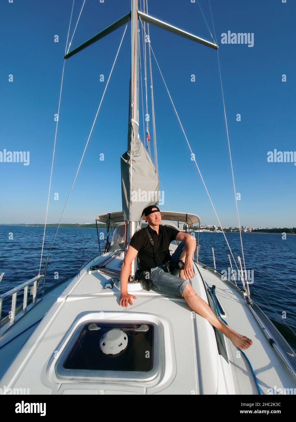 A man in a boat on calm water hi-res stock photography and images - Alamy