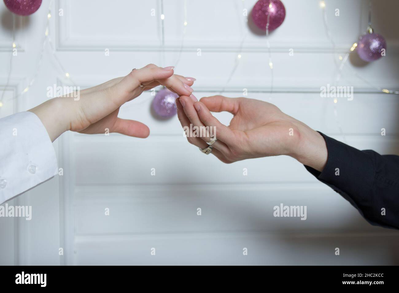 Couples holding hands.a man's hand touches a woman's hand Stock Photo