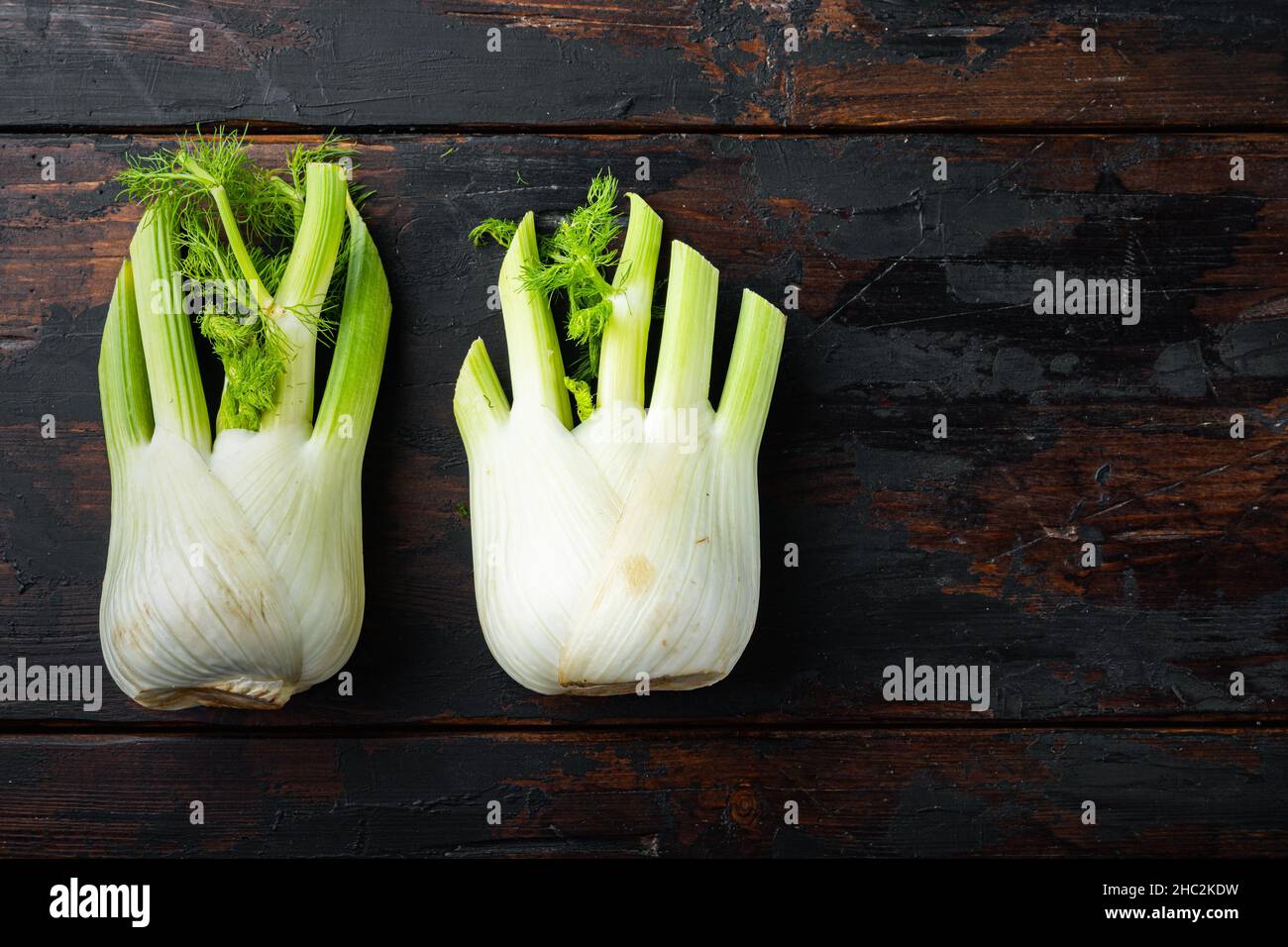 Fresh organic fennels, on old wooden table, flat lay with space for ...