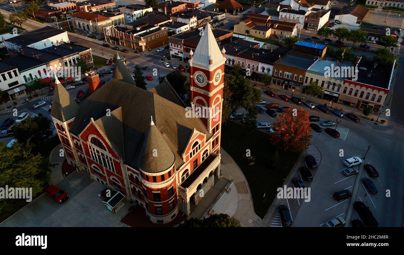Aerial view at sunset of Historic 1844 Courthouse with clock tower in the center of the Monroe