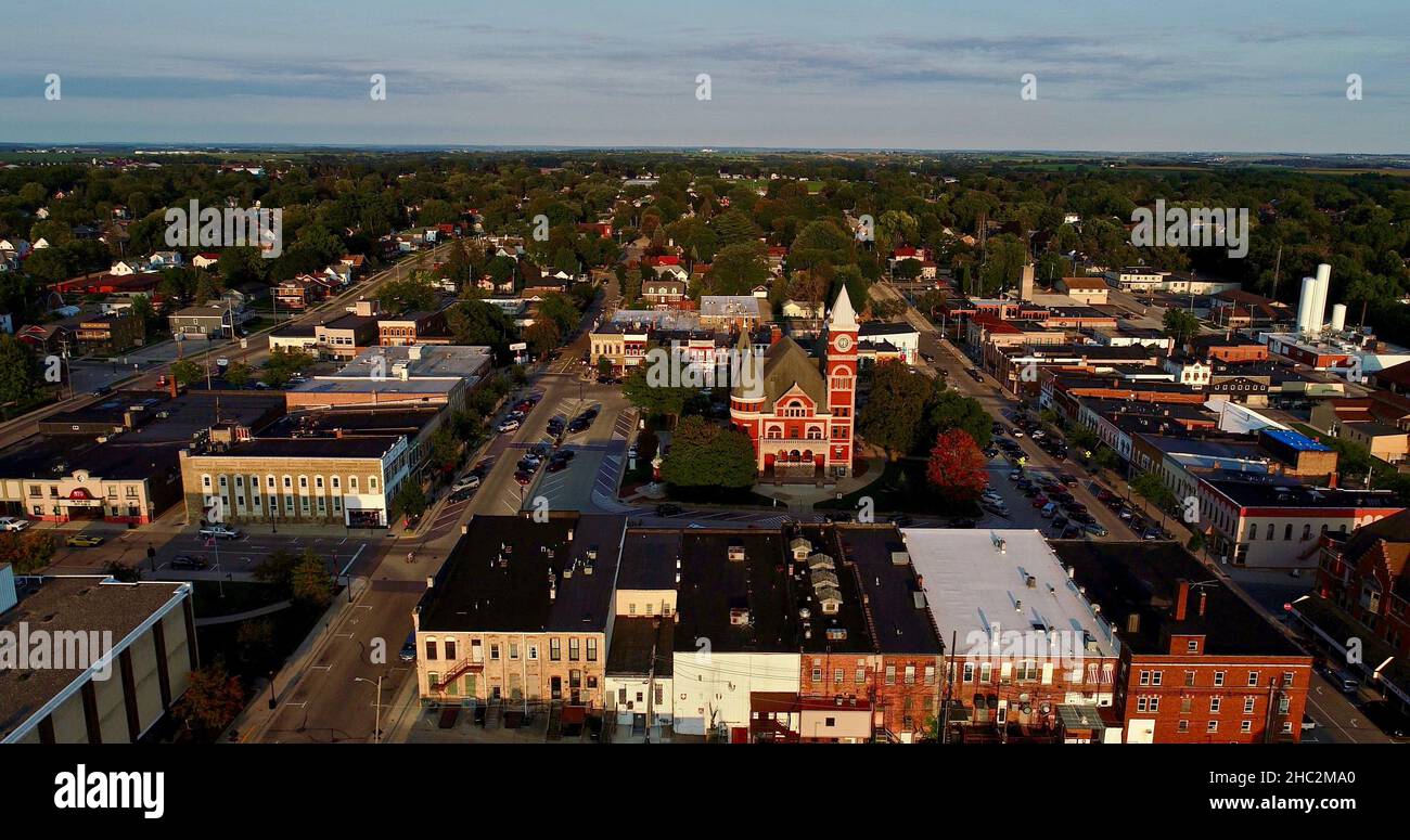 Aerial view at sunset of Historic 1844 Courthouse with clock tower in the center of the Monroe