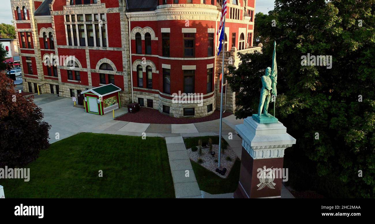 Aerial view at sunset of Historic 1844 Courthouse with clock tower in the center of the Monroe