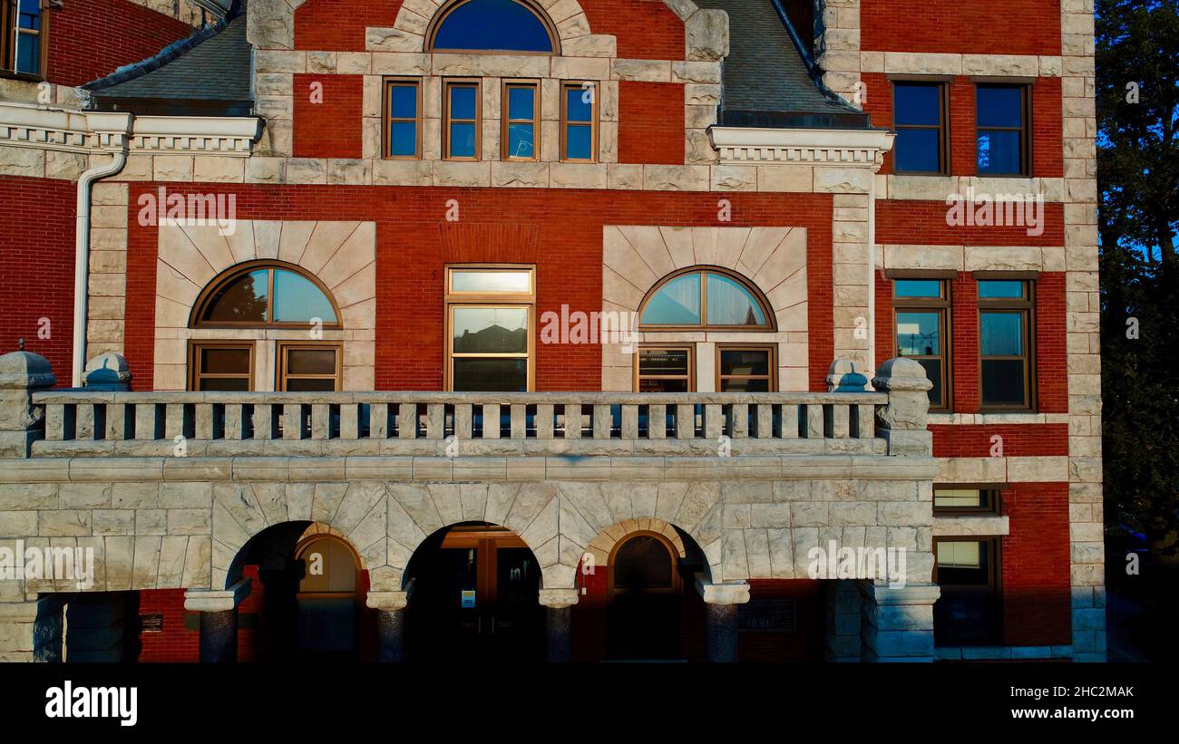 Aerial view at sunset of Historic 1844 Courthouse with clock tower in the center of the Monroe