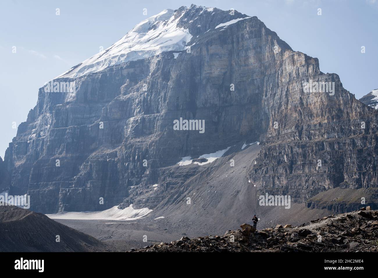 Massive standalone mountain with glacier on its top from Banff National Park in Canadian Rockies. Stock Photo