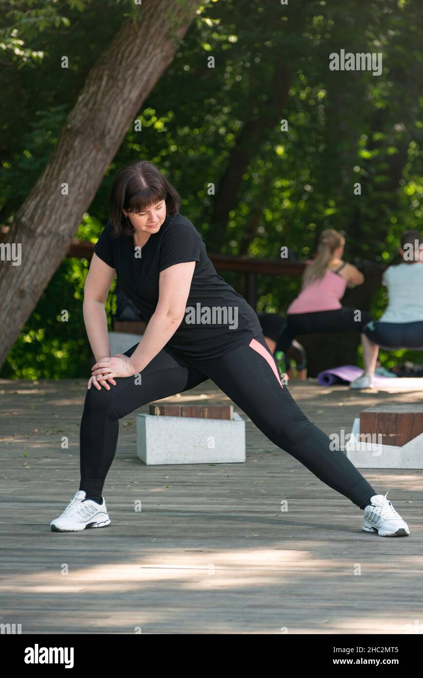 Young pretty girl of slender body building, dressed in sports form is  engaged in outdoor sports. Funny summer holidays Stock Photo - Alamy