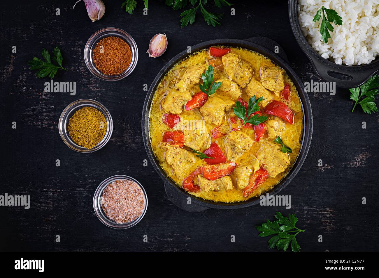 Traditional Indian curry chicken masala. Indian chicken curry with sweet peppers and rice in
