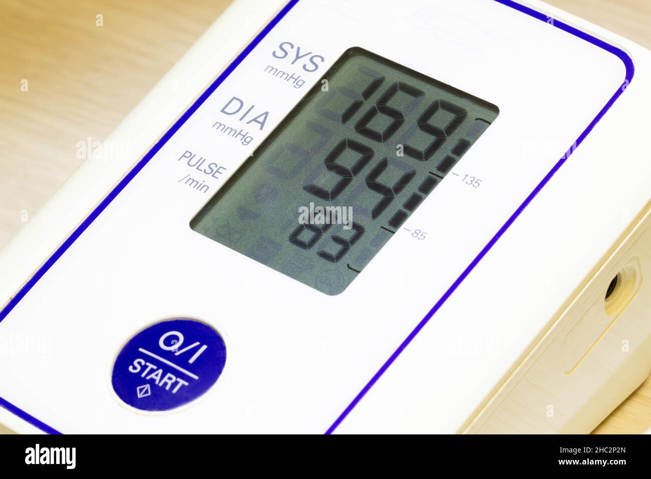 The digital blood pressure monitor shows very high arterial blood pressure and heart rate