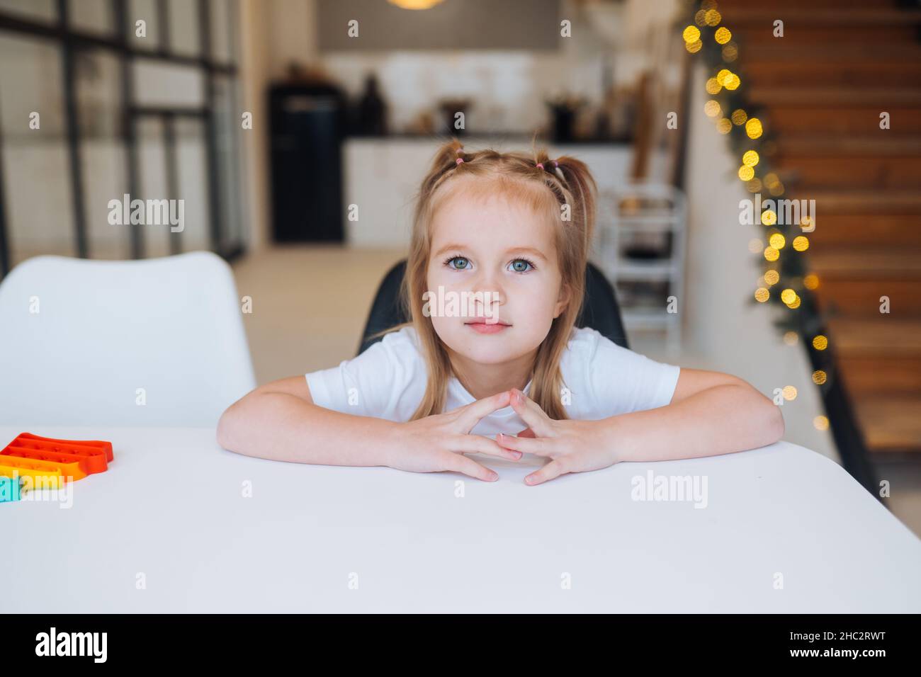 Adorable little girl looking at the camera close-up Stock Photo - Alamy