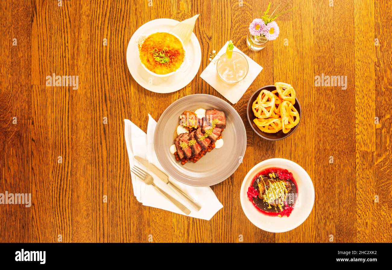 Santa Maria Style Tritip, Pork Shoulder Carnitas and Golden Hominy and Cheese Casserole with