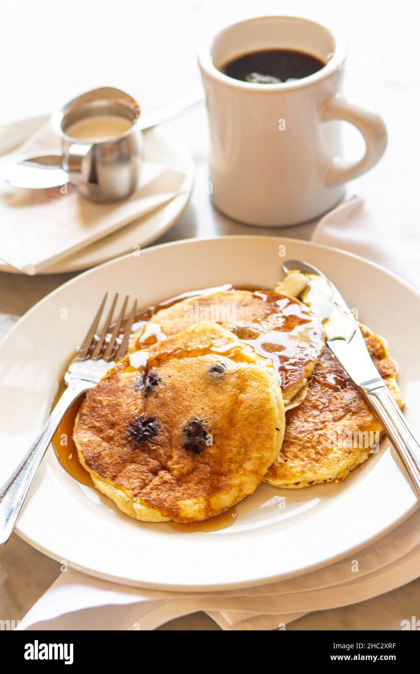 blueberry ricotta pancakes and a cup of coffee for breakfast Stock Photo