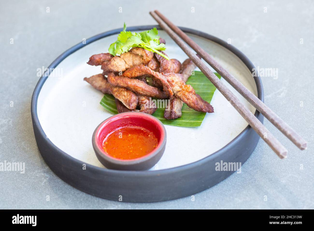 Thai beef jerky and sticky rice, Khao Kaeng Thai Restaurant, Montecito, California Stock Photo