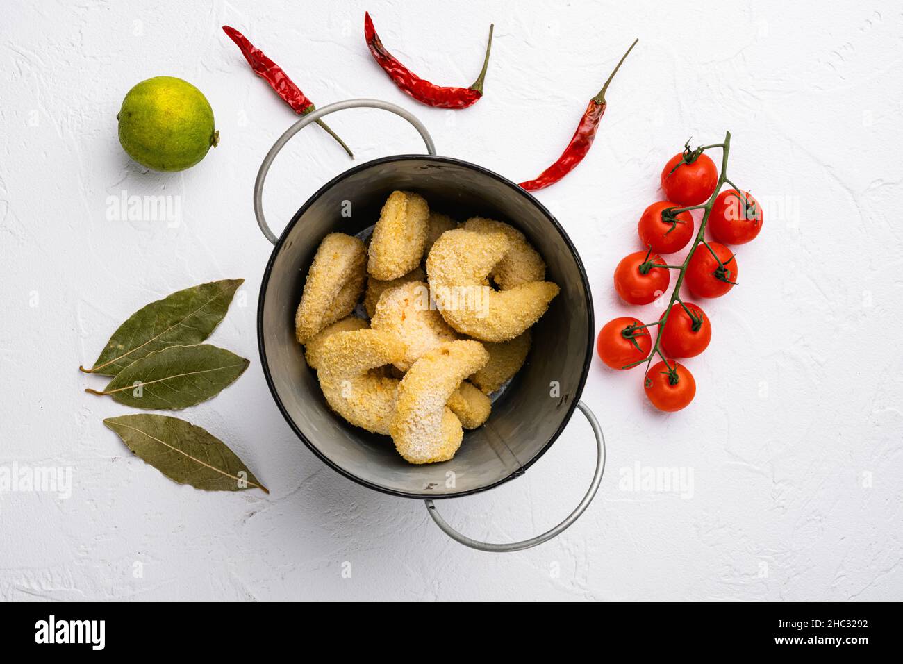 Raw breaded shrimp set, on white stone table background, top view flat ...