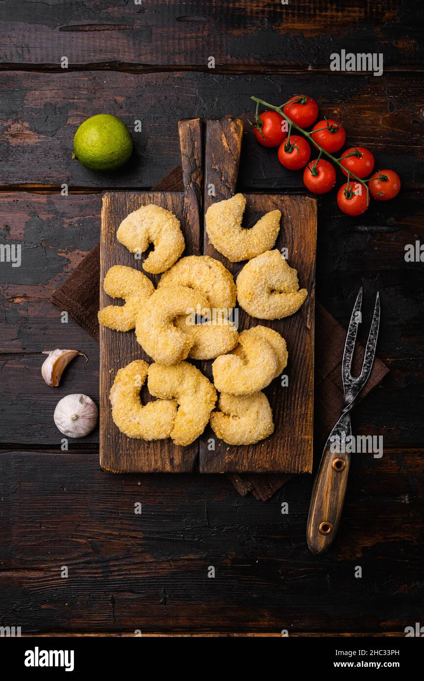 Breaded Deep Fried shrimps set, on old dark wooden table background ...