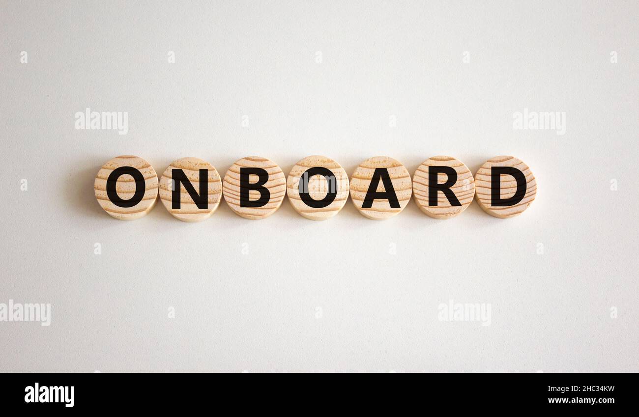 Onboard and onboarding symbol. The concept word Onboard on wooden