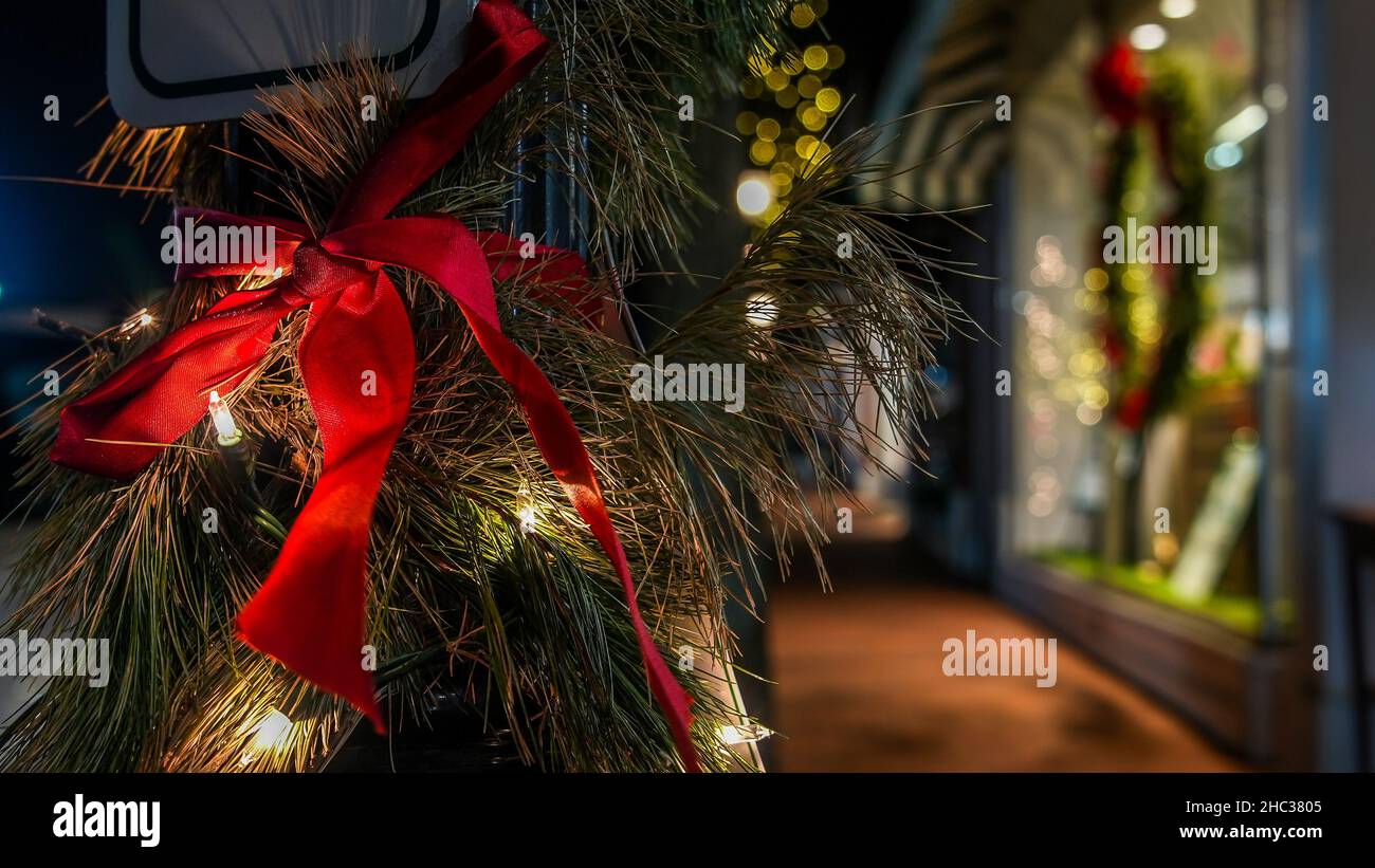 Christmas decoration with holidays light and store front at evening