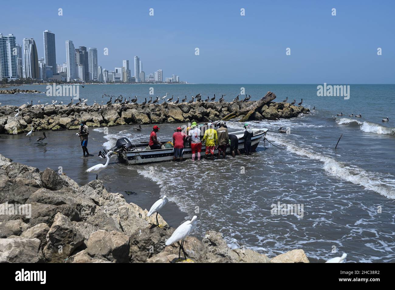 Fishermen working on Bocagrande beach in Cartagena de Indias, Colombia Stock Photo