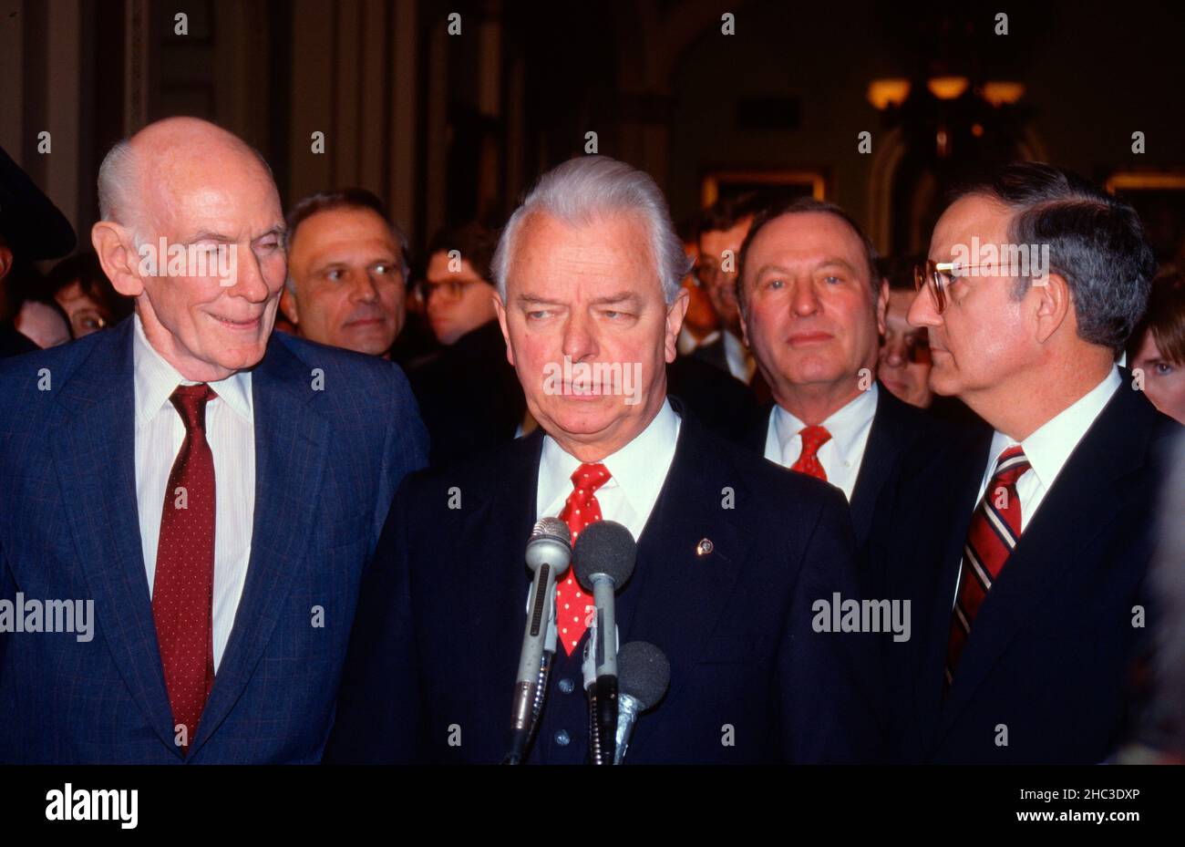 United States Senate Majority Leader Robert Byrd (Democrat of West Virginia), center, speaks to reporters after the US Senate Democratic Caucus elected US Senator George Mitchell (Democrat of Maine), right, as Majority Leader for the 101st Congress in the US Capitol in Washington, DC on November 29, 1988. Also photographed are US Senator Alan Cranston (Democrat of California), left; US Senator David Pryor (Democrat of Arkansas), Secretary of the Senate Democratic Conference, left center; and US Senator Alan J Dixon (Democrat of Illinois), second right. Credit: Arnie Sachs/CNP Stock Photo