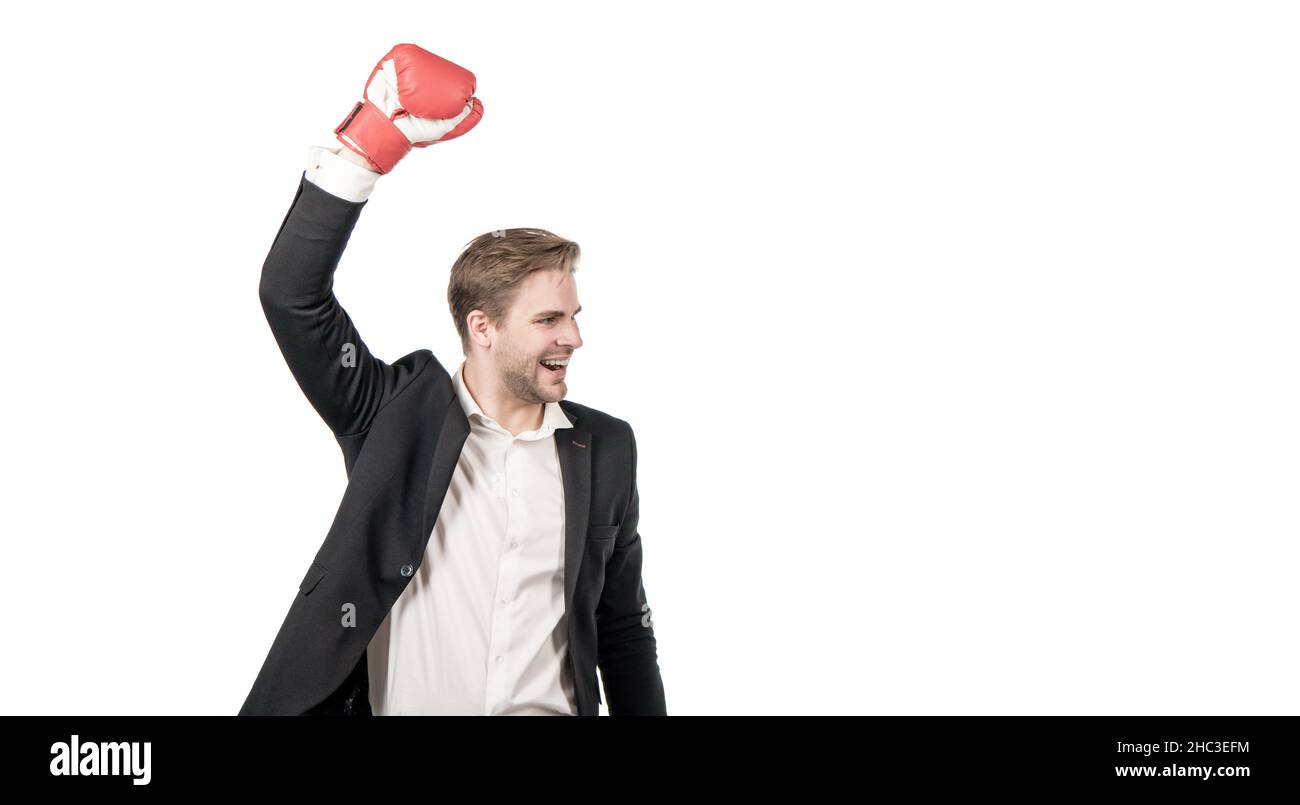 Success is born in fight. Happy businessman raise hand in boxing glove