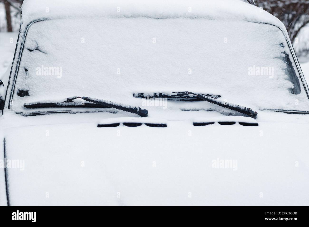 Car windshield wipers and windscreen in snow, closeup Stock Photo Alamy