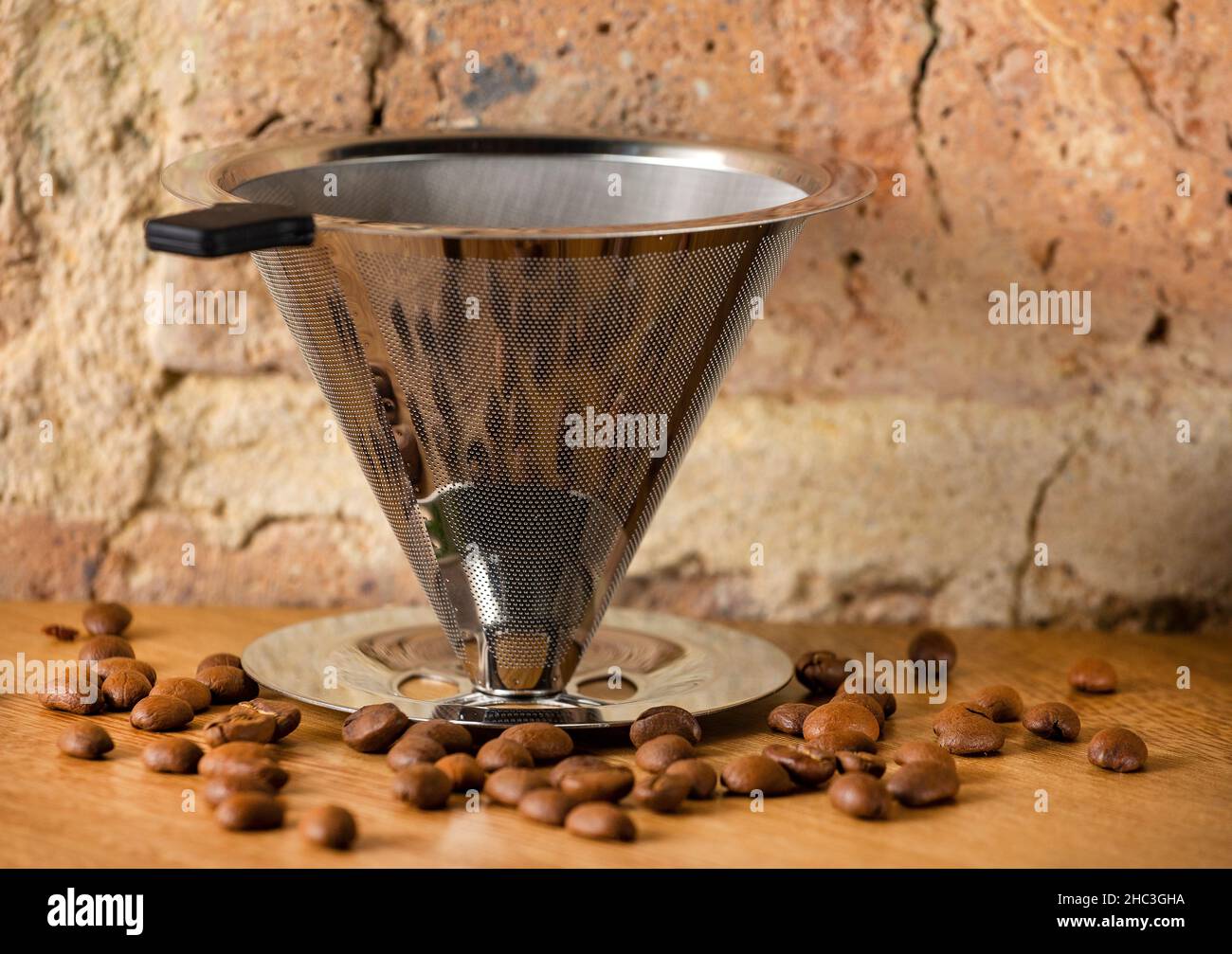 Reusable metal cone slow drip coffee filter Stock Photo Alamy