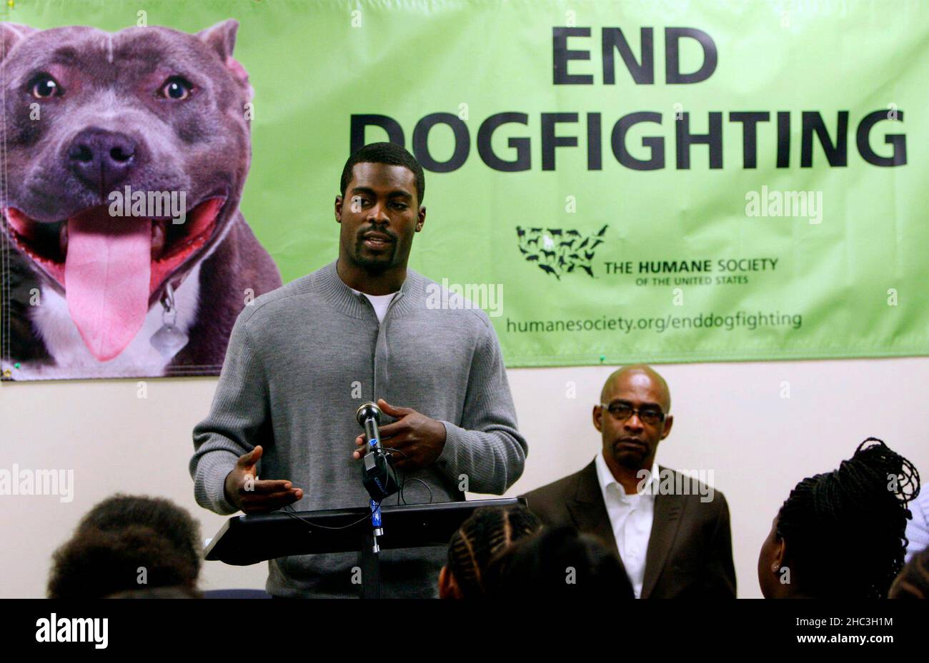 Durham, USA. 26th Feb, 2010. Philadelphia Eagles quarterback Michael Vick makes a stop in Durham, North Carolina, Friday, Feb. 26, 2010, to speak to students and local residents at the New Horizons alternative school about his mistakes being involved in dog fighting and of second chances in life. He was introduced to the packed assembly room by Ralph Hawthorne, right, of the Humane Society of the United States. (Photo by Harry Lynch/The News & Observer/TNS/Sipa USA) Credit: Sipa USA/Alamy Live News Stock Photo