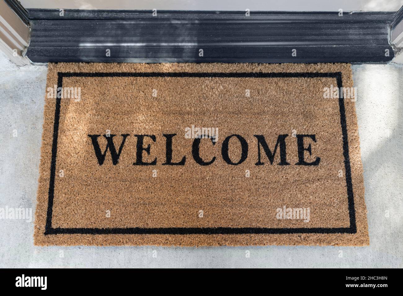 Clean mat outside suburban front door Stock Photo Alamy