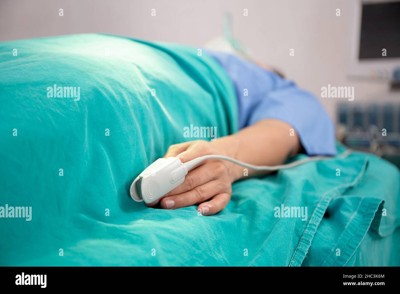 Closeup pulse oximeter with finger of patient at hospital, cardiology and exam heart, disease