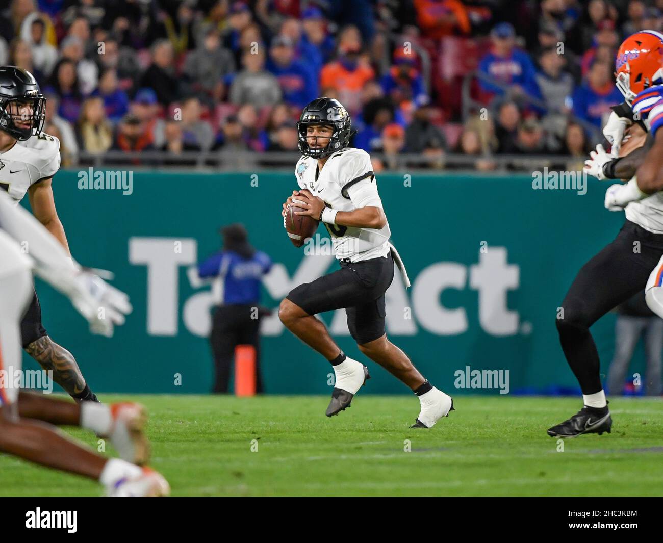 Tampa, FL, USA. 23rd Dec, 2021. UCF Knights quarterback Mikey Keene (16) looks to throw the ball during the 1st half of Union Home Mortgage Gasparilla Bowl between the Florida Gators and the UCF Knights at Raymond James Stadium in Tampa, FL. Romeo T Guzman/CSM/Alamy Live News Stock Photo