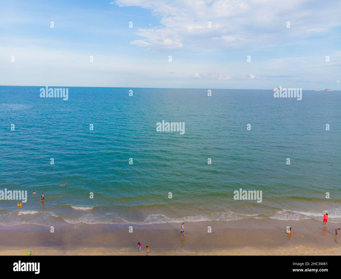 Aerial view tropical white sand beach turquoise water with tourist ...